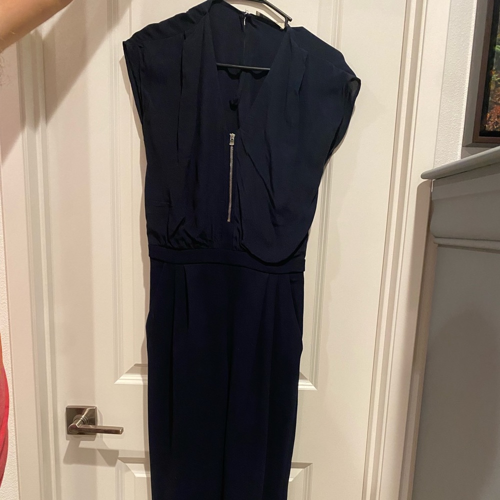 Mng navy blue jumpsuit. Zipper in front and keyhole opening in back. Size xs